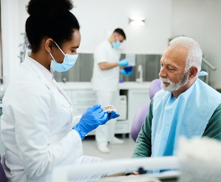 Dentist discussing dentures in Camp Hill