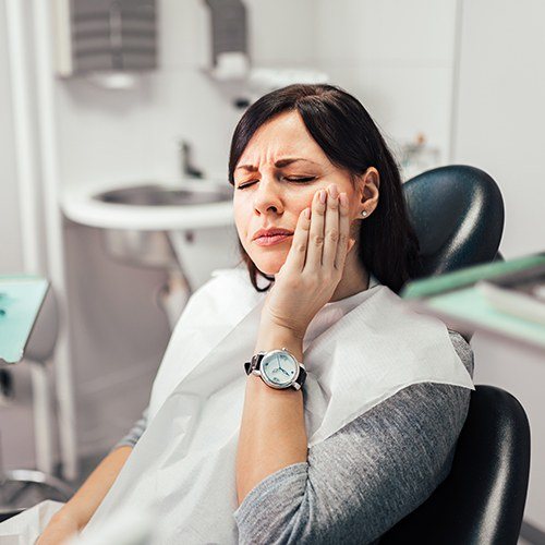 woman in severe pain at the dentist