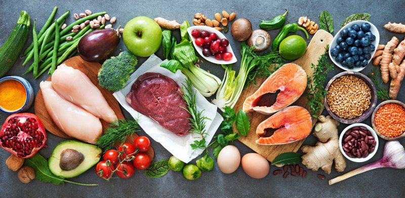 a spread of healthy foods including lean meats, fruits, and vegetables