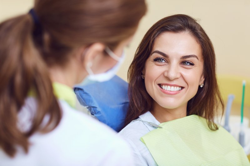 Woman listening to cosmetic dentist