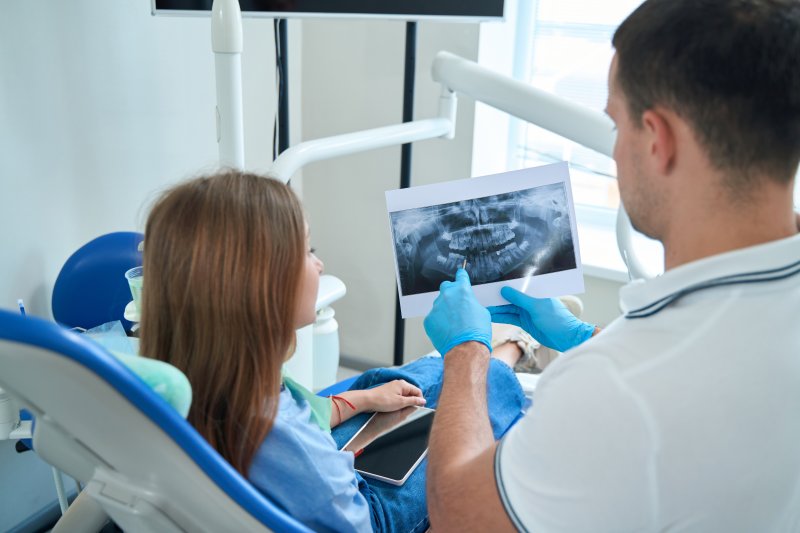 patient talking with dentist about cosmetic dentistry